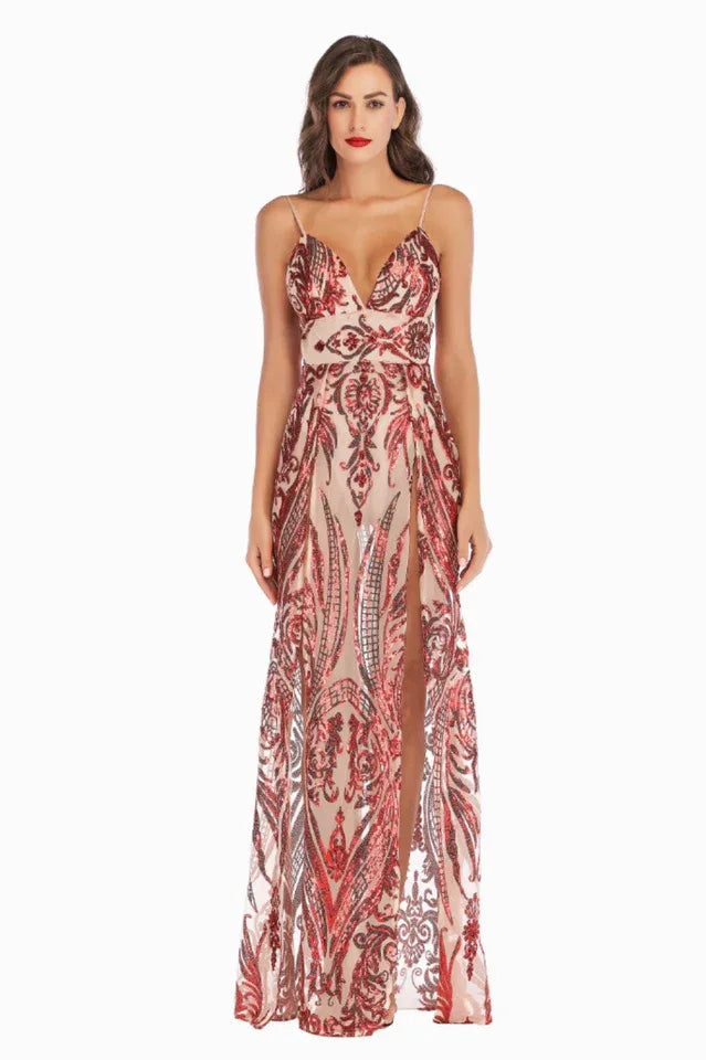 Full-length portrait of a woman in an ornate, sequined evening dress with a V-neck and high slit.