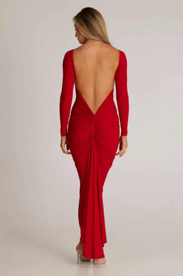 woman wearing a red long-sleeved maxi dress with a low back Main image