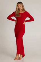 woman in a red long-sleeved column dress