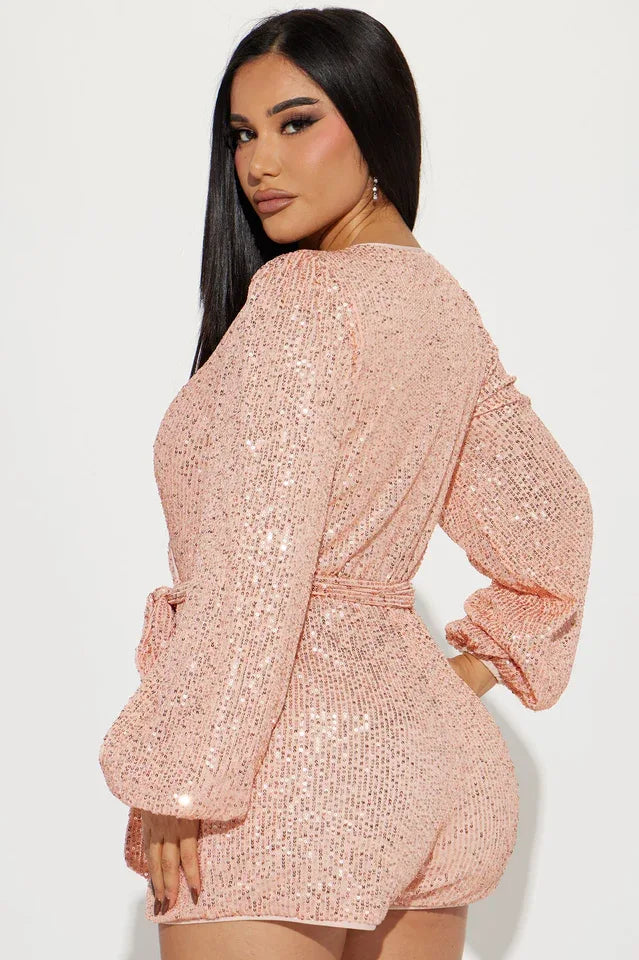 back view of a woman in a pink sequin romper