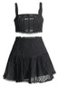 Black embroidered eyelet crop top and flared skirt set laid flat.