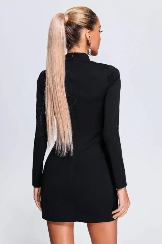 back view of a woman wearing a black mini dress with long sleeves