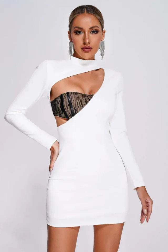 woman wearing a white mini dress with an asymmetrical cut-out and mock neck