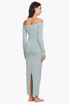 Model wearing a light blue off-the-shoulder maxi dress from the back