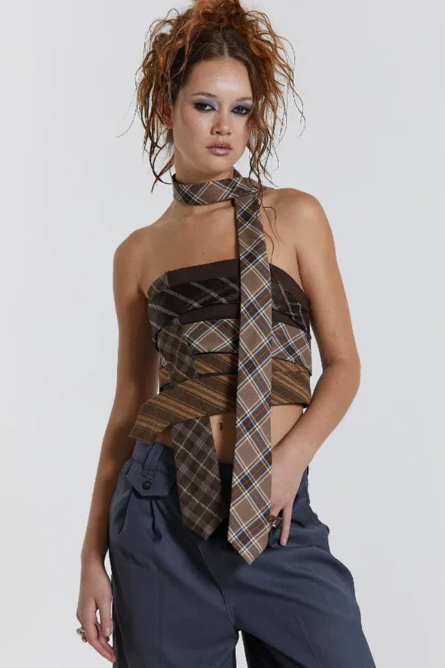 Model wearing a strapless plaid top and gray pants Main image
