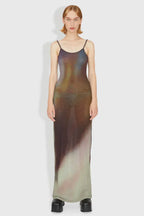 Model wearing a sheer, ombre knit maxi dress with spaghetti straps, front view.