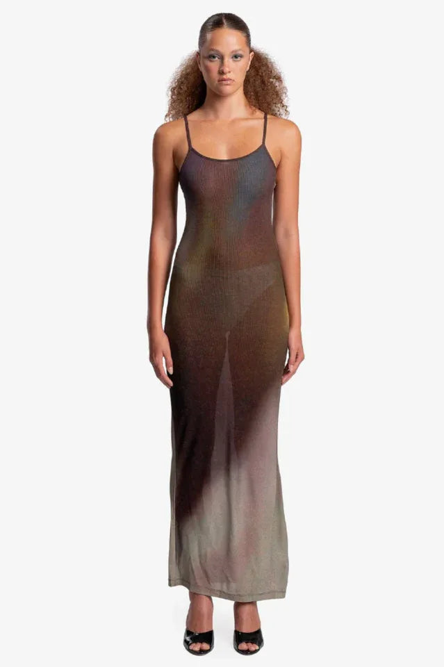 Woman wearing a sheer, ombre knit maxi dress with spaghetti straps, front view.