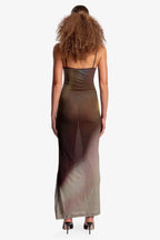 Woman wearing a sheer, ombre knit maxi dress with spaghetti straps, back view.