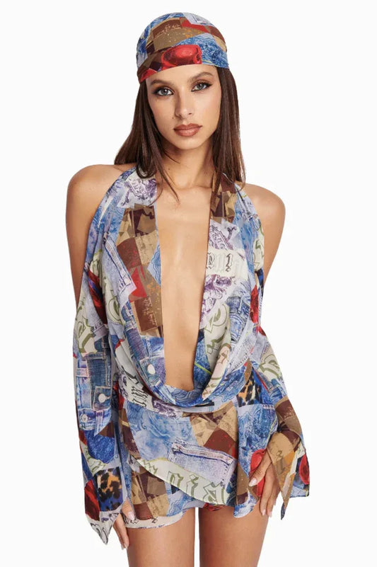 Woman wearing a collage print mini dress with a deep V-neck and long sleeves, paired with a matching headscarf.