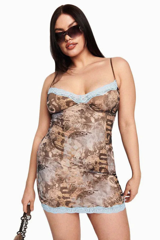Plus-size model wearing a brown graphic print mini dress with light blue lace trim