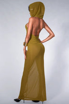 Back view of a model in an olive green hooded maxi dress, highlighting the open back and sheer skirt.