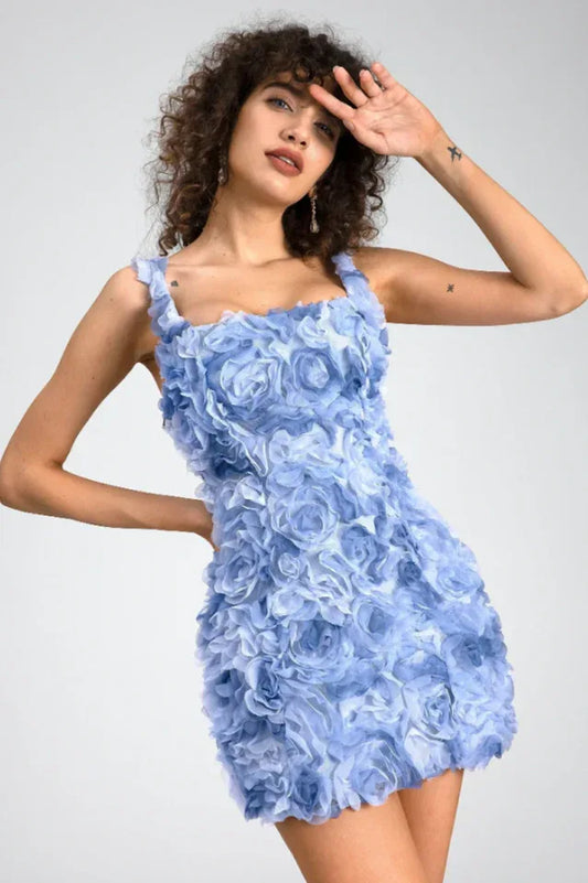 Woman in a light blue floral applique mini dress, front view