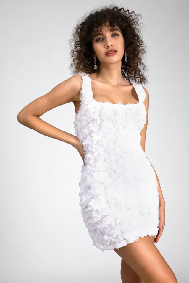 Woman in a white floral applique mini dress, front view