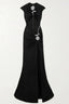 Full view of a black velvet evening gown with a cut-out, high slit, and rose embellishment.