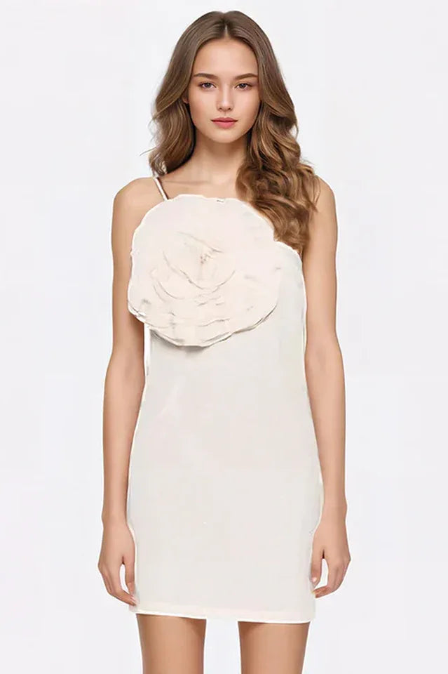 Cream one-shoulder mini dress with large floral applique on the bust, worn by a woman with blonde hair. Secondary image