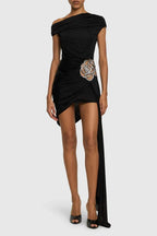 Black one-shoulder asymmetrical hem dress with draped bodice and rose embellishment