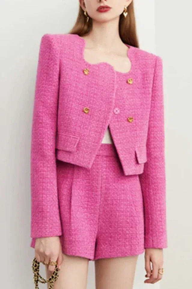 Woman wearing a pink tweed cropped jacket and shorts set Main image