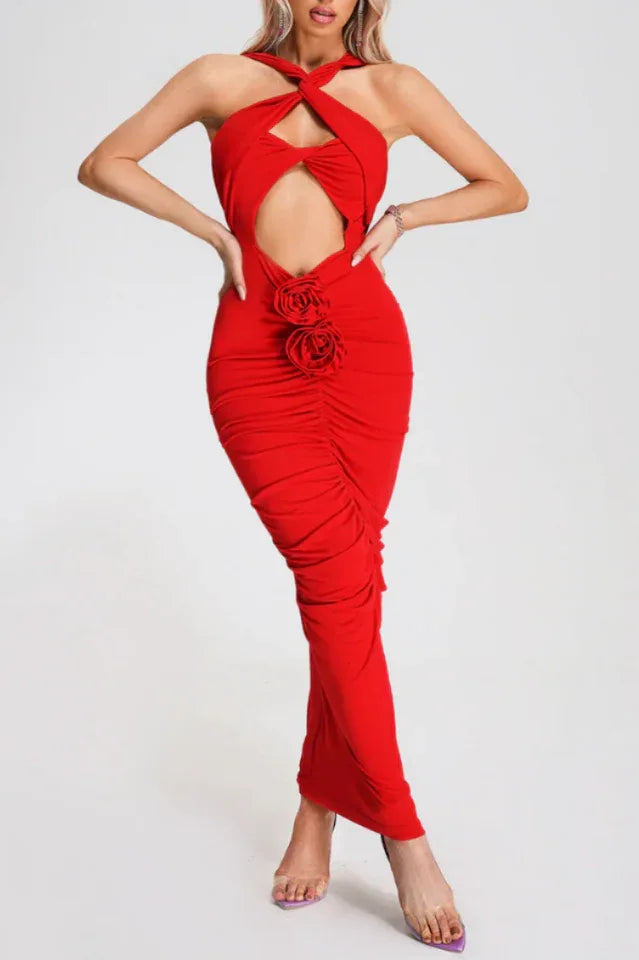 woman wearing a red halter neck maxi dress with a cutout and rose detail Main image