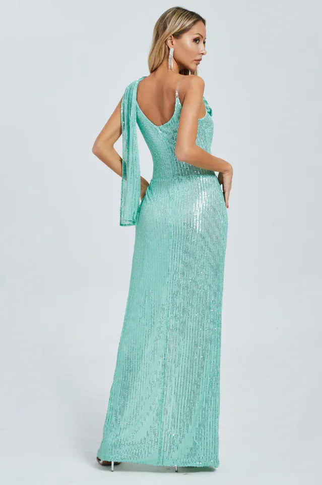 Back view of a mint green sequined gown with a sleeveless design and draped shoulder detail.