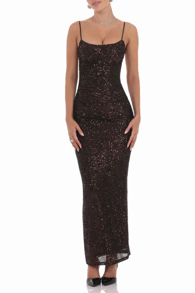 Woman wearing a floor-length dark sequined dress with spaghetti straps and a sweetheart neckline, front view