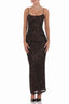 Woman wearing a floor-length dark sequined dress with spaghetti straps and a sweetheart neckline, front view