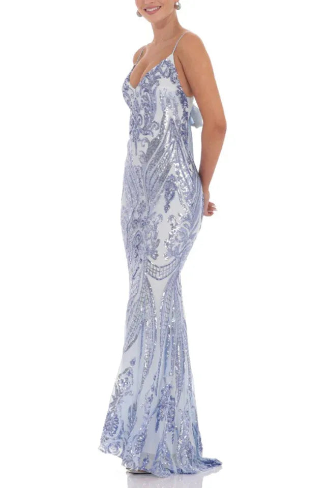 Side view of a woman wearing a light blue sequined mermaid prom dress with spaghetti straps and a V-neckline.