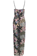 Close-up front view of a floor-length sequined gown with floral appliqués and sheer fabric.