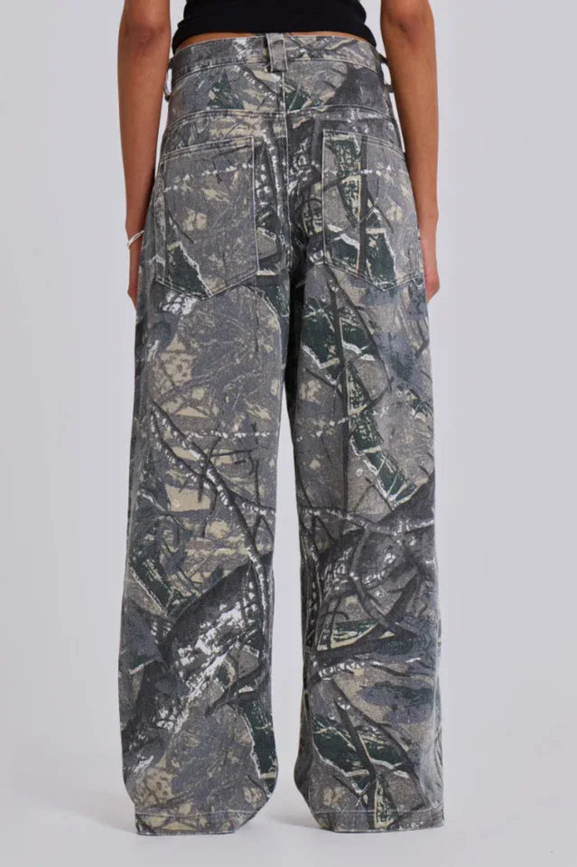 Close-up of the back of camouflage wide-leg jeans worn by a woman.