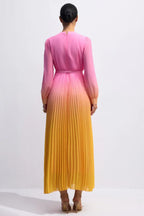 Back view of a model wearing a pink to yellow ombre pleated chiffon maxi dress, showcasing the full length and pleating.