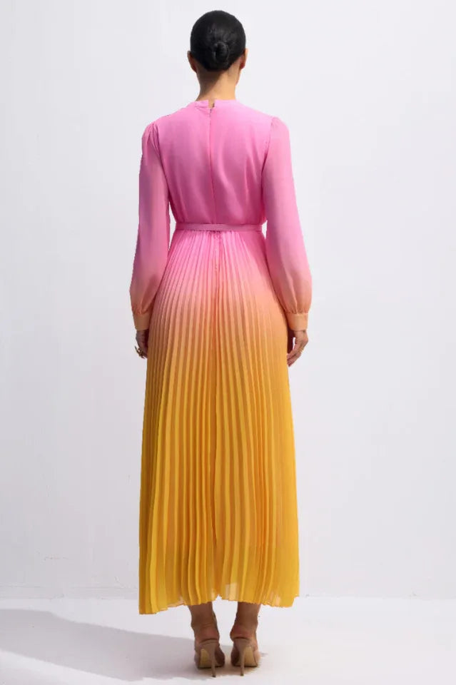 Back view of a model wearing a pink to yellow ombre pleated chiffon maxi dress, showcasing the full length and pleating.