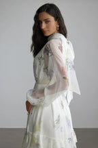 Side view of the white floral print chiffon dress, highlighting the sleeve detail.