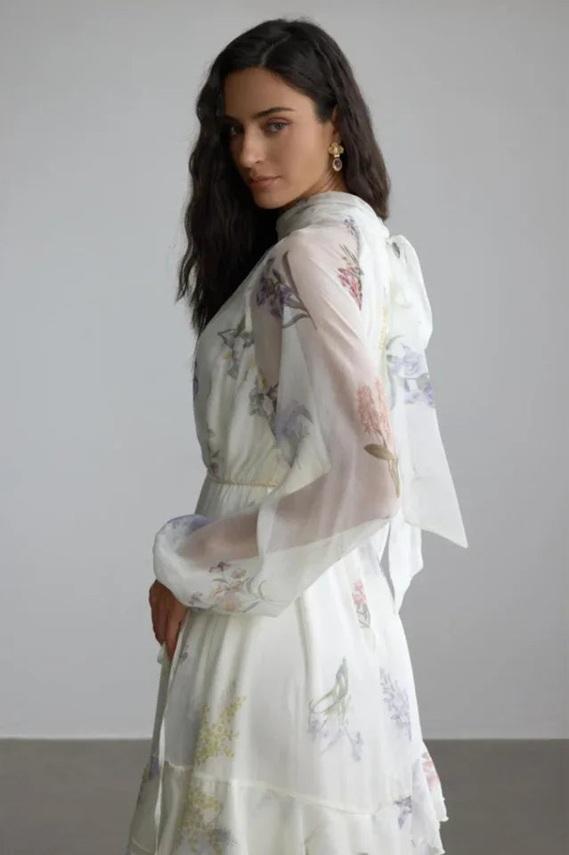 Side view of the white floral print chiffon dress, highlighting the sleeve detail.