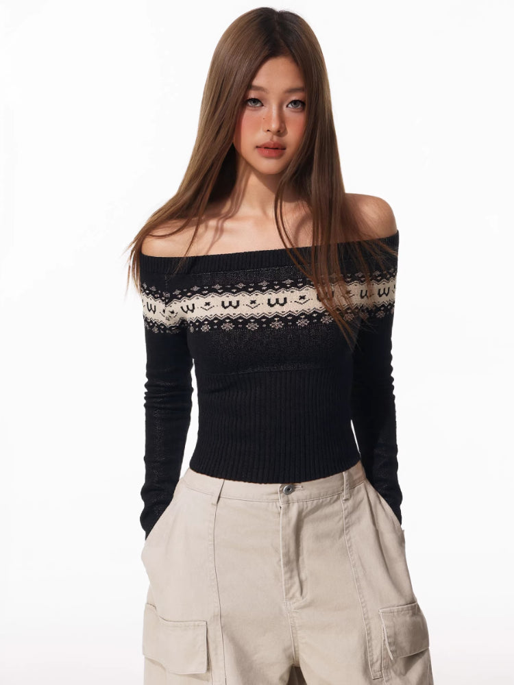 A woman models a black off-the-shoulder sweater with a patterned yoke and beige wide-leg cargo pants.
