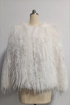 White faux fur jacket with a shaggy, fringed texture displayed on a mannequin.
