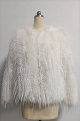 White faux fur jacket with a shaggy, fringed texture displayed on a mannequin.