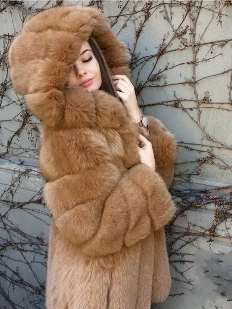 Woman wearing a tan faux fur hooded coat with eyes closed