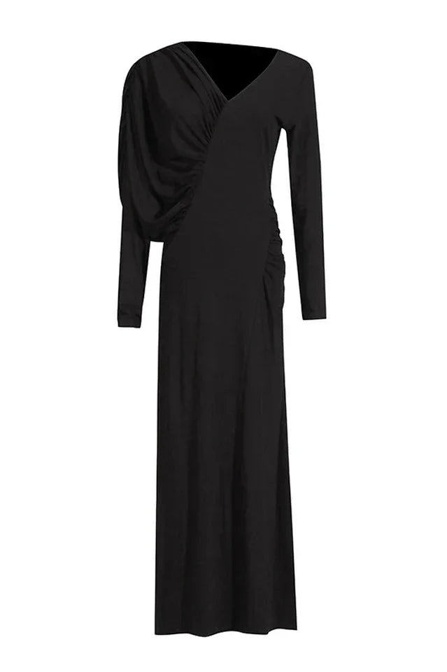 A long-sleeved black dress with asymmetrical draping and ruching, displayed flat.