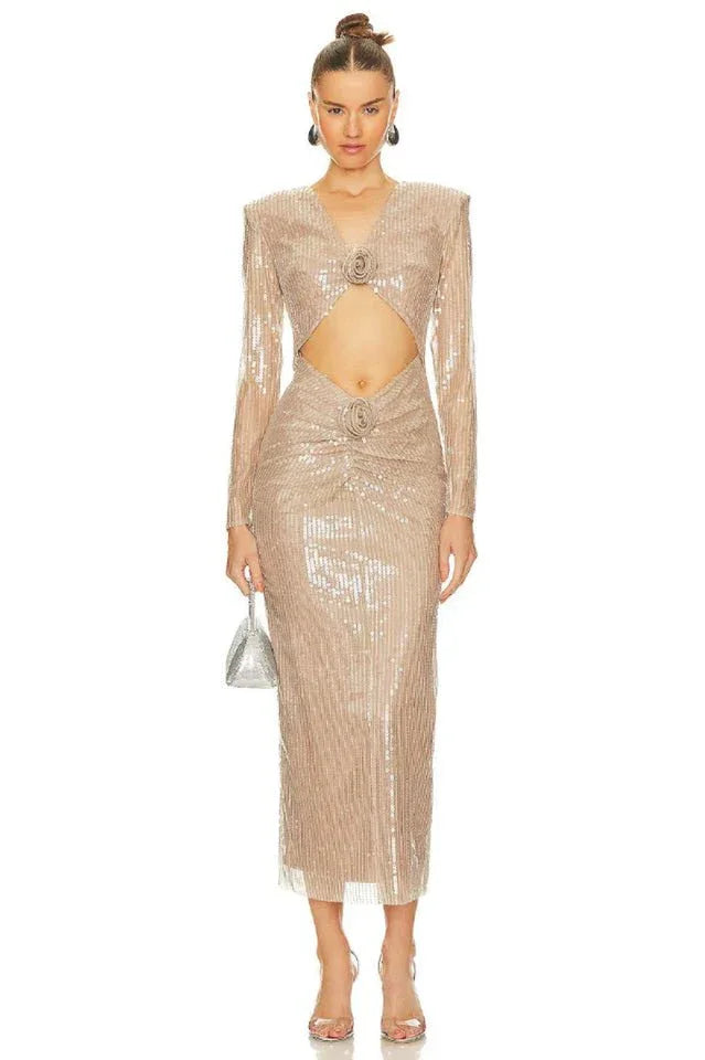 A full-length view of a sequined gown with a deep v-neck, cut-outs, and ruched detailing. Secondary image