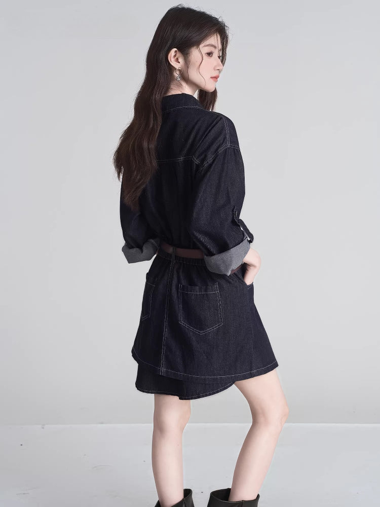 Rear view of a woman wearing a dark wash denim shirt dress with a brown belt.