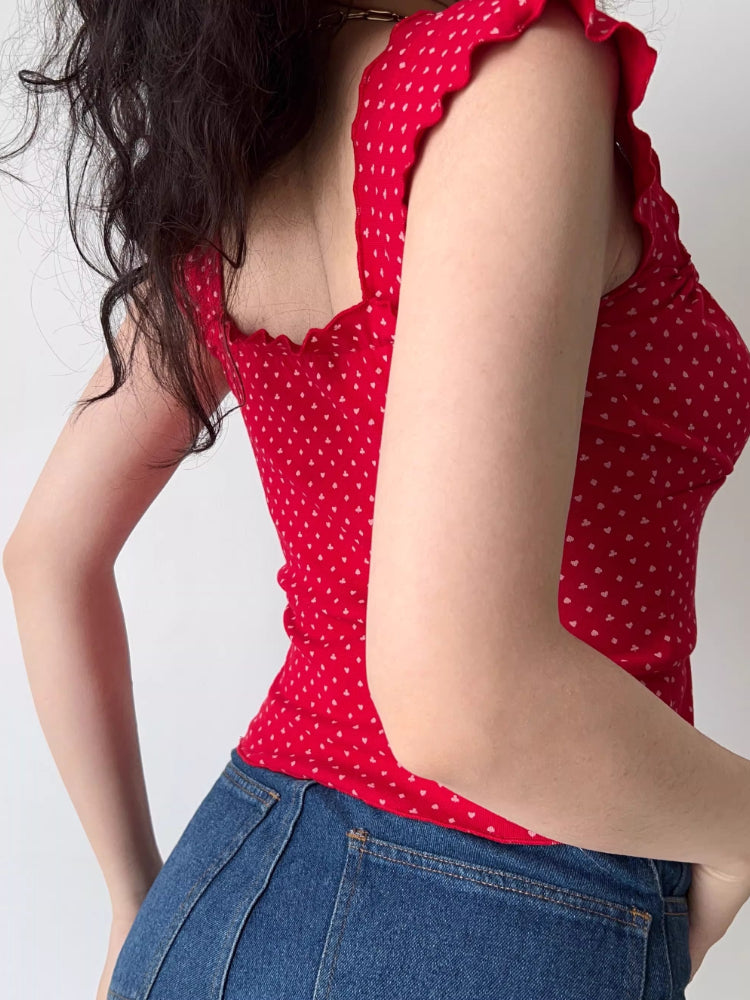 Side view of the red heart print top and denim shorts