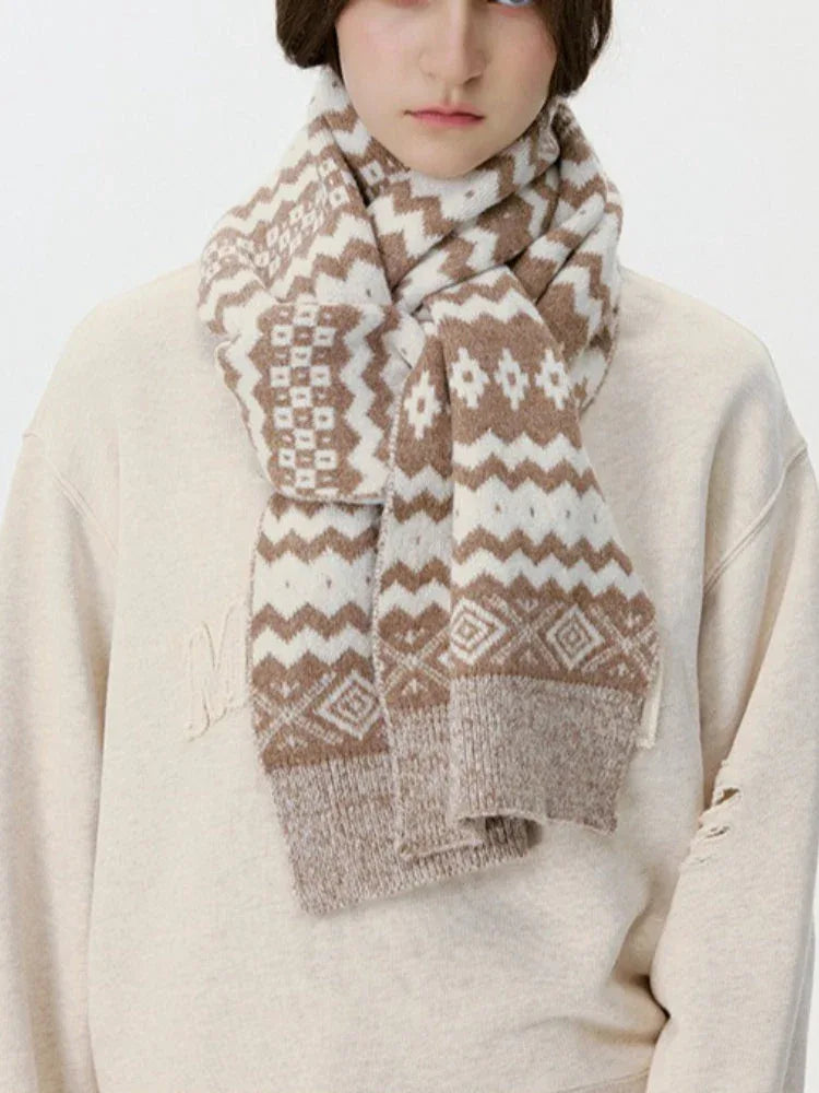 Close-up of a brown and white Fair Isle knit scarf with geometric patterns