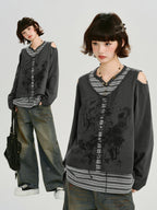 Split image showing a model wearing a grey long-sleeve top with cold shoulder cutouts and a graphic print, layered over a striped t-shirt, and a full body shot of the outfit.