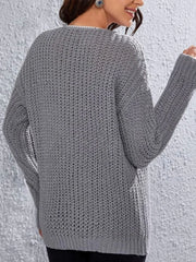 Back view of a woman in a grey knit sweater