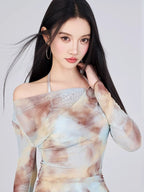 Close-up of a woman wearing a tie-dye print mesh overlay top