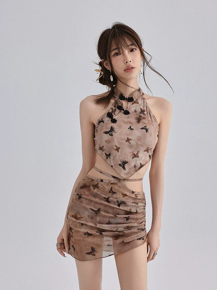 Woman modeling a two-piece butterfly print outfit