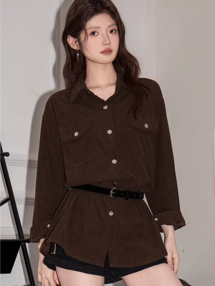 Woman in a brown corduroy shirt dress and black shorts