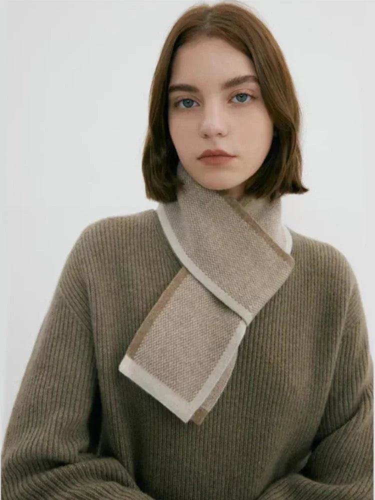 Model wearing a taupe knit sweater and scarf
