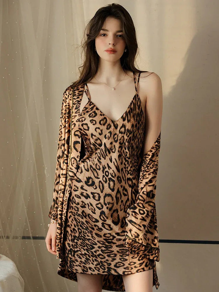 Woman wearing a leopard print satin cami slip dress and matching robe. Main image