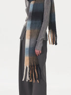Close-up of a model's hand and scarf
