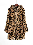 Hooded faux fur tiger print long coat hanging on a hanger.